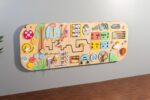 Rounded sensory wall panels in Pastel color for kids museums, libraries, waiting areas and preschool classrooms. Wall-mounted busy board. - Image 2