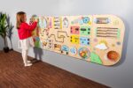 Rounded sensory wall panels in Pastel color for kids museums, libraries, waiting areas and preschool classrooms. Wall-mounted busy board. - Image 4